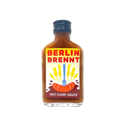 Berlin Brennt Hot Curry Sauce in einer Flasche mit gelbem Etikett, 150 ml.